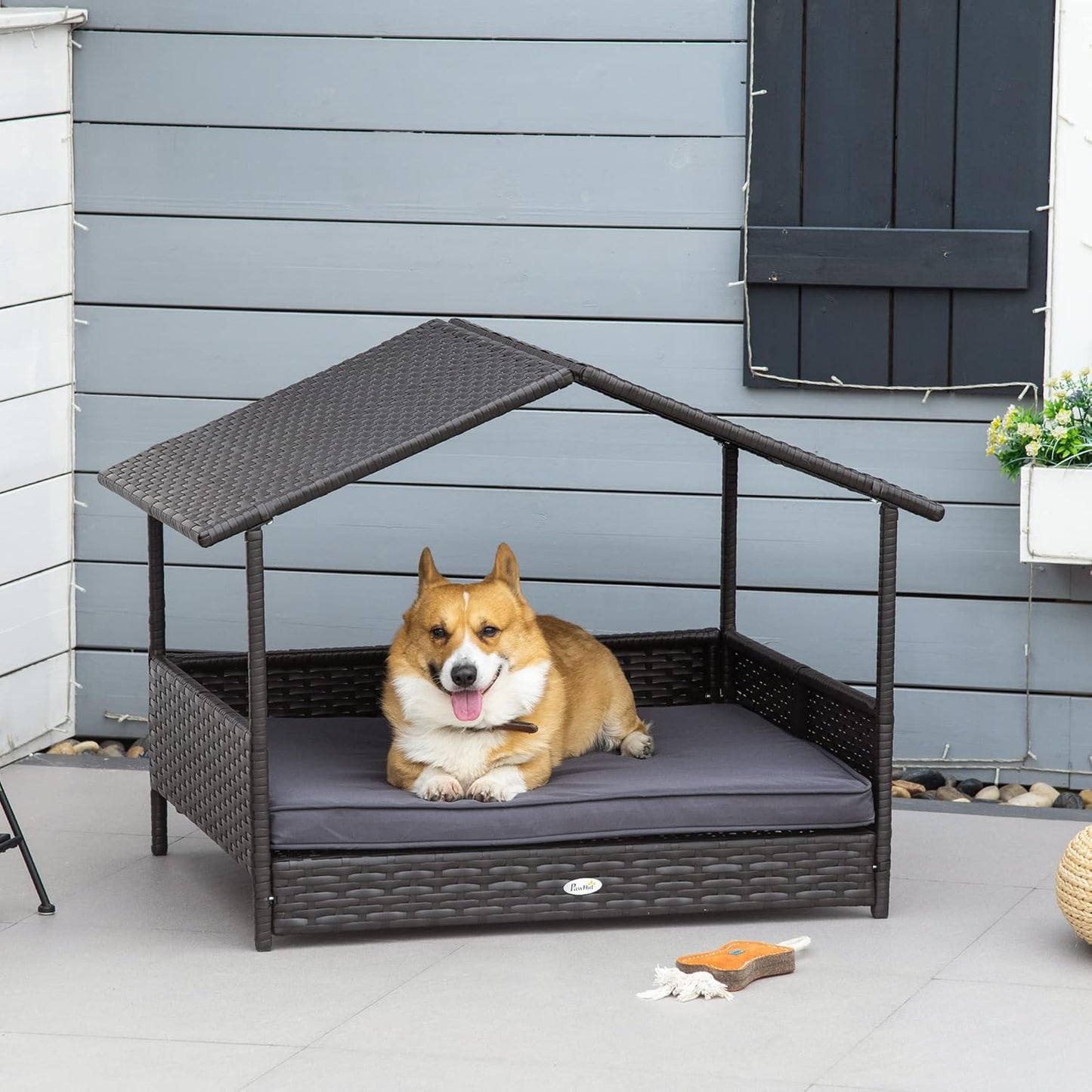 PawHut Wicker Dog House Outdoor with Canopy, Rattan Dog Bed with Water-Resistant Cushion, Raised Dog Bed for Small, Medium Dogs up to 66 lbs, 19.75" in Length, Brown Wicker, Gray Cushion